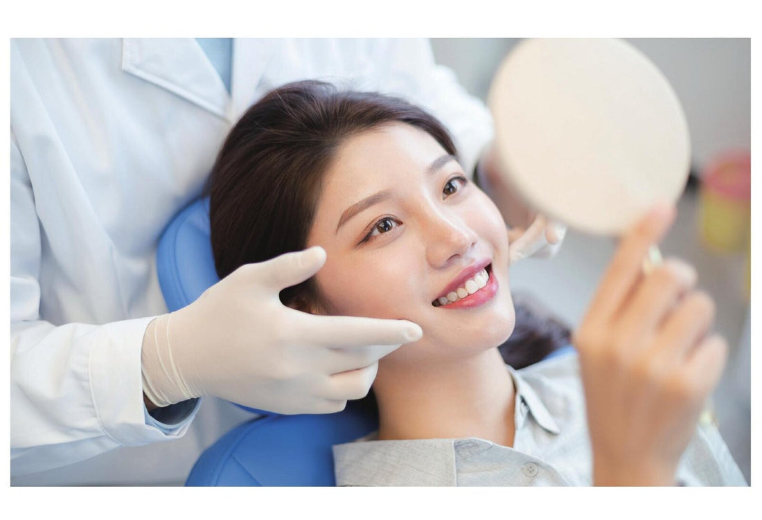 A patient smiling in the chair at a Taikang Bybo (泰康拜博) dental clinic in China during an implant consultation