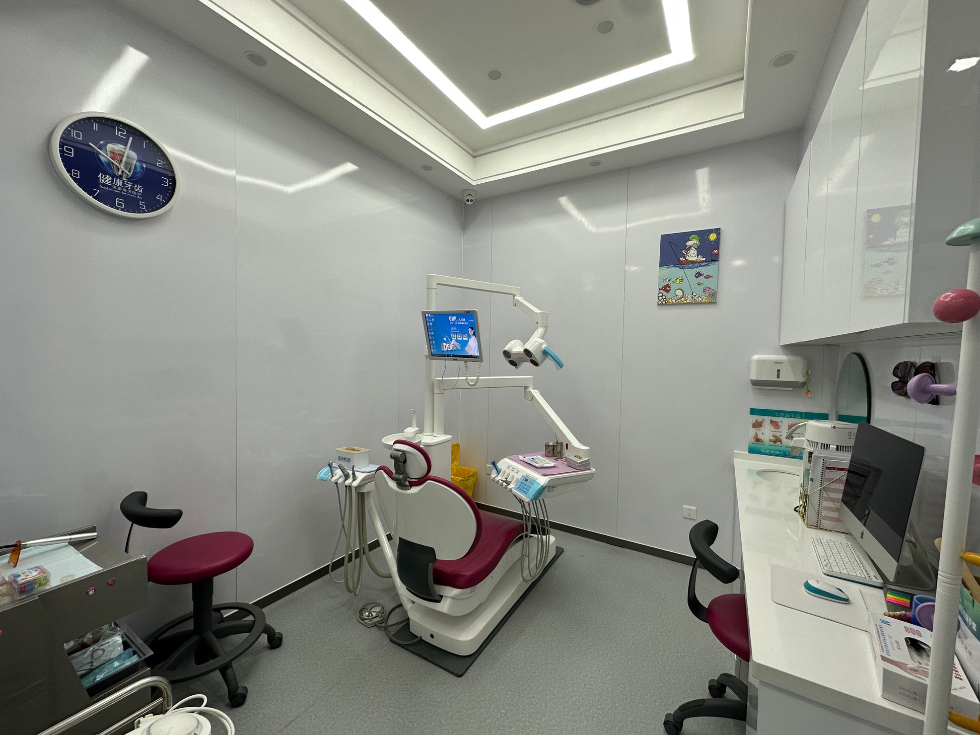Dental treatment room with patient chair and chairside monitor